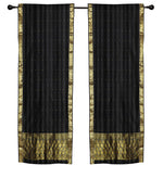 Black sari rod pocket curtains hung at a window