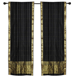 Black sari rod pocket curtains hung at a window
