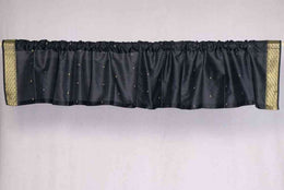 Black sari valance mounted above a window