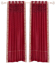 Fire brick sari grommet top curtains hung at a window