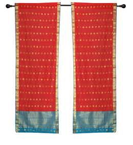 Red sari rod pocket curtains hung at a window