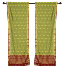 Green sari rod pocket curtains hung at a window