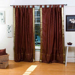 Brown sari tab top curtains hung at a window