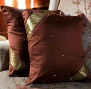 Sophisticated brown sari cushion covers arranged on a sofa