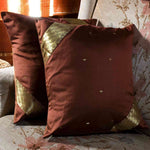 Sophisticated brown sari cushion covers arranged on a sofa
