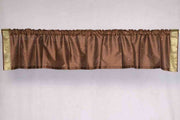 Brown sari valance mounted above a window