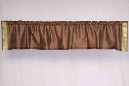 Brown sari valance mounted above a window