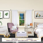 White sari tab top curtains hung at a window