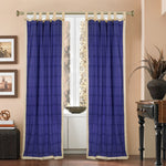 Cream sari tab top curtains hung at a window