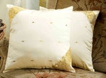 Cream sari cushion covers arranged on a sofa