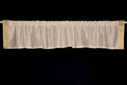 Cream sari valance mounted above a window