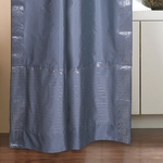 Silver sari rod pocket curtains hung at a window