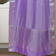 Lavender sari rod pocket curtains hung at a window