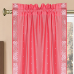 Silver sari rod pocket curtains hung at a window