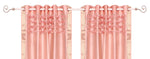 Peach sari grommet top curtains hung at a window