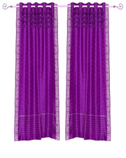 Violet sari grommet top curtains hung at a window