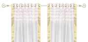 White sari grommet top curtains hung at a window
