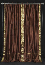 Brown sari tie top curtains hung at a window