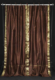Brown sari tie top curtains hung at a window