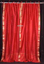 Fire brick sari tie top curtains hung at a window