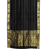 Black sari rod pocket curtains hung at a window