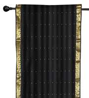 Black sari rod pocket curtains hung at a window