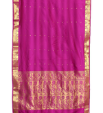 Purple sari rod pocket curtains hung at a window