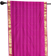 Purple sari rod pocket curtains hung at a window