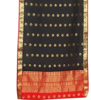 Black sari rod pocket curtains hung at a window