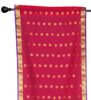 Sari rod pocket curtains hung at a window