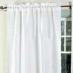 Silver sari rod pocket curtains hung at a window
