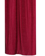 Burgundy velvet ring top curtains hung at a window