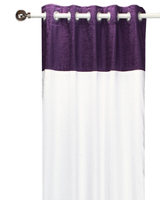 Purple velvet ring top curtains hung at a window