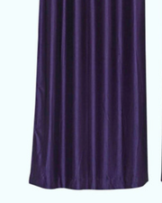 Purple sari grommet top curtains hung at a window