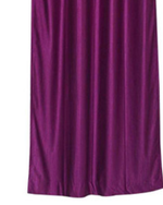 Wine sari grommet top curtains hung at a window