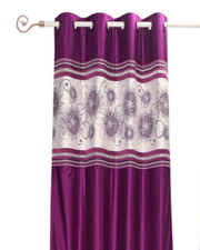 Wine sari grommet top curtains hung at a window