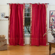 Fire brick sari tie top curtains hung at a window