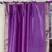 Lavender sari tie top curtains hung at a window
