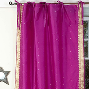 Violet sari tie top curtains hung at a window