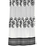 Black sheer tissue ring top curtains hung at a window