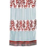 Maroon sheer tissue ring top curtains hung at a window