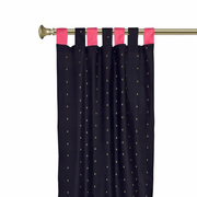 Black sari tab top curtains hung at a window