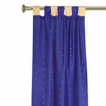 Blue sari tab top curtains hung at a window