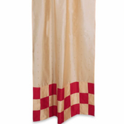 Gold sari tab top curtains hung at a window