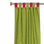 Olive green sari tab top curtains hung at a window