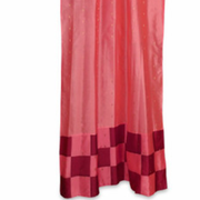 Peach sari tab top curtains hung at a window