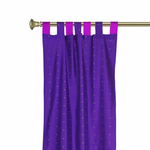 Lavender sari tab top curtains hung at a window