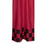 Red sari tab top curtains hung at a window