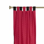 Red sari tab top curtains hung at a window