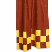 Yellow sari tab top curtains hung at a window